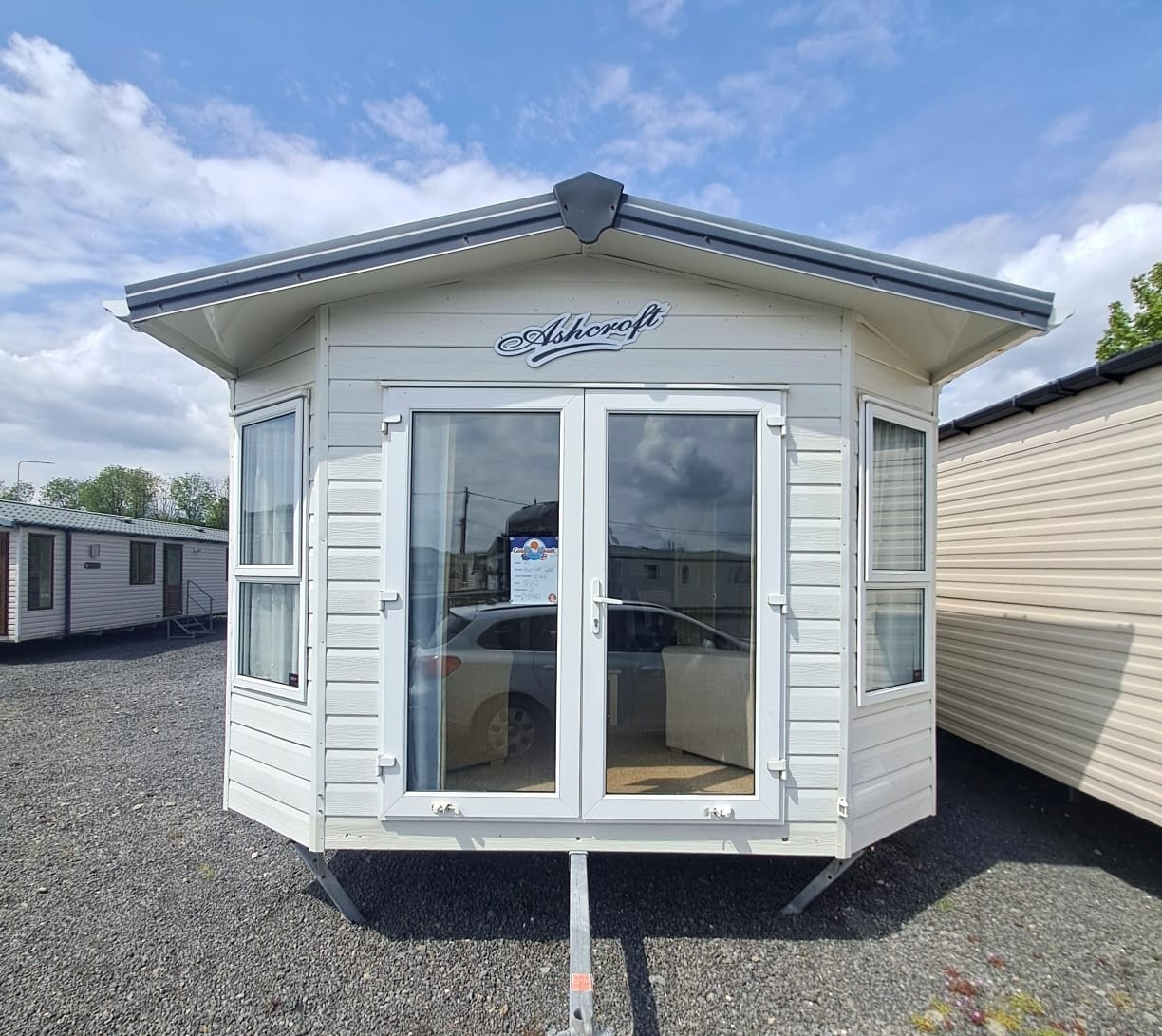 ABI ASHCROFT SUPER 38 X 12 WITH 2 AMPLE SIZED BEDROOMS, EN SUITE, 2 TOILETS, DOUBLE GLAZING & CENTRAL HEATING WITH PATIO FRONT OPENING DOORS For Sale Thumb